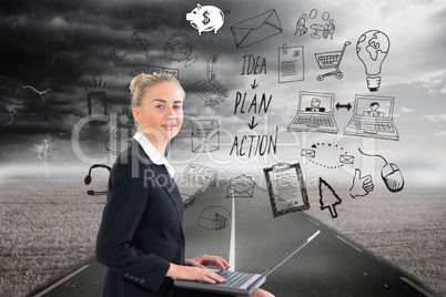 Composite image of businesswoman using laptop