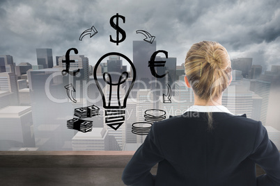 Composite image of businesswoman standing with hands on hips