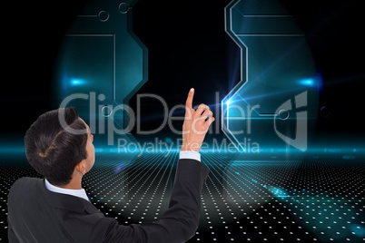 Composite image of asian businessman pointing