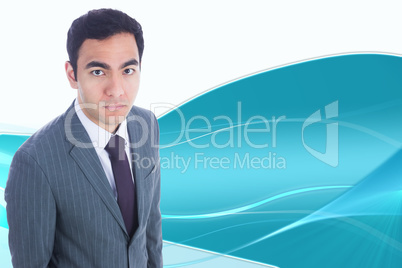 Composite image of unsmiling businessman standing