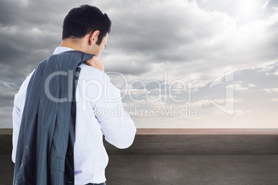 Composite image of businessman standing