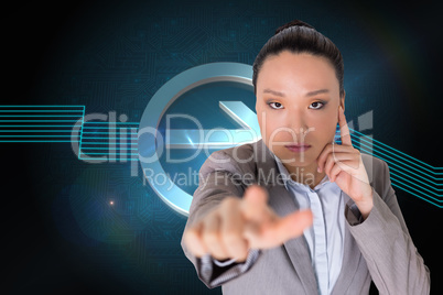 Composite image of thoughtful asian businesswoman pointing