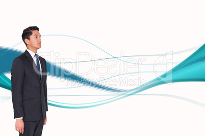 Composite image of stern businessman looking away