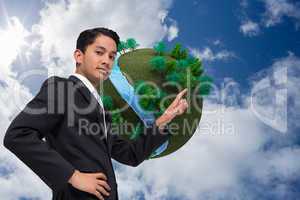 Composite image of unsmiling asian businessman pointing