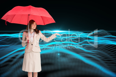 Composite image of attractive businesswoman holding red umbrella