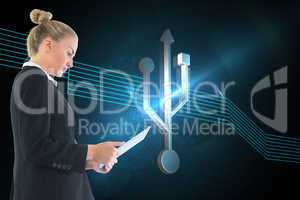 Composite image of businesswoman holding tablet