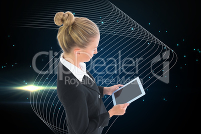 Composite image of businesswoman holding new tablet