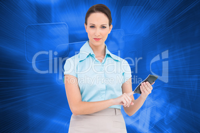 Composite image of serious classy businesswoman using calculator