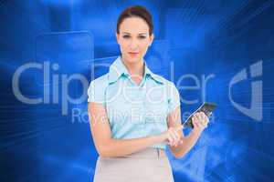 Composite image of serious classy businesswoman using calculator