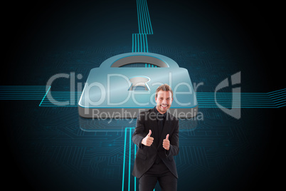 Composite image of businessman with thumbs up in a meeting