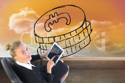 Composite image of businesswoman sitting on swivel chair with ta