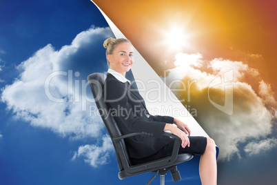 Composite image of businesswoman sitting in swivel chair