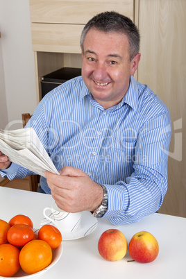 man reading the newspaper in his spare time