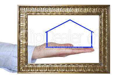 outstretched hand behind photo frame with house