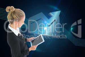 Composite image of businesswoman holding new tablet