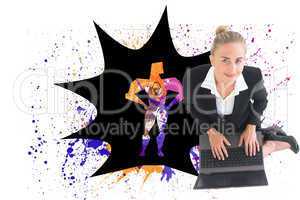 Composite image of businesswoman using laptop