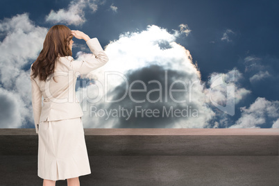 Composite image of rear view of young businesswoman looking away