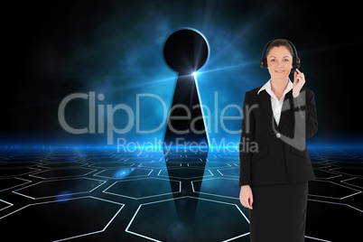 Composite image of good looking woman in suit using headphones a