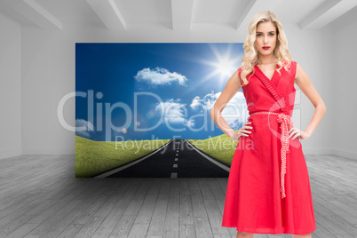 Composite image of elegant blonde standing hands on hips