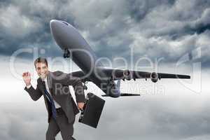 Composite image of happy businessman in a hury