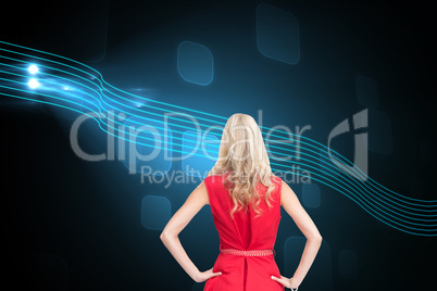 Composite image of elegant blonde standing hands on hips