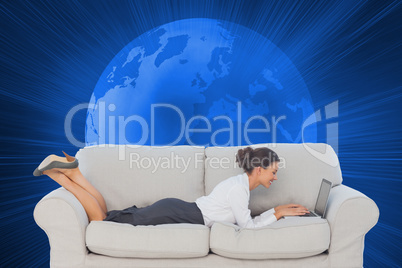 Composite image of business woman lying on couch