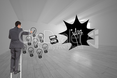 Composite image of businessman standing on ladder