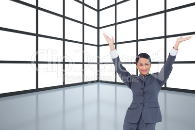 Composite image of cheering businesswoman