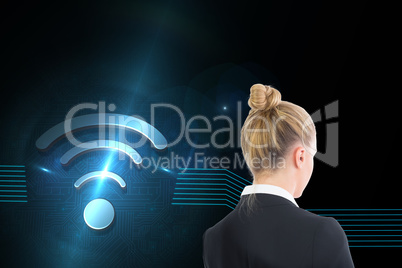 Composite image of businesswoman holding tablet