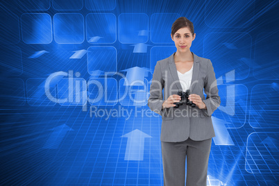 Composite image of young businesswoman with binoculars