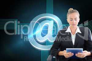 Composite image of businesswoman sitting on swivel chair with ta