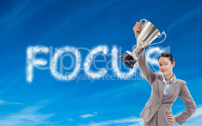 Composite image of businesswoman showing a cup