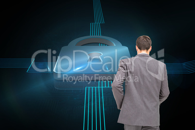 Composite image of young businessman walking away from camera