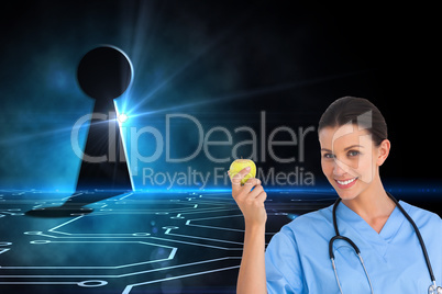 Composite image of happy surgeon holding an apple and smiling at