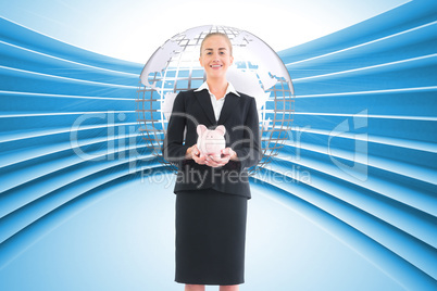 Composite image of businesswoman holding pink piggy bank