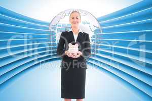 Composite image of businesswoman holding pink piggy bank