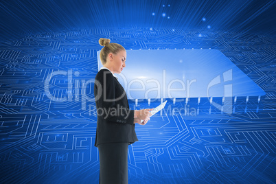 Composite image of businesswoman holding new tablet Composite image of businesswoman holding new tablet