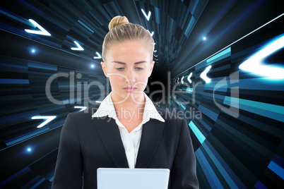 Composite image of businesswoman holding tablet