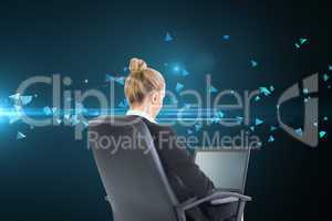 Composite image of businesswoman sitting on swivel chair with la