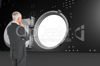 Composite image of thoughtful businessman standing back to camer