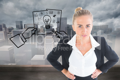 Composite image of businesswoman standing with hands on hips