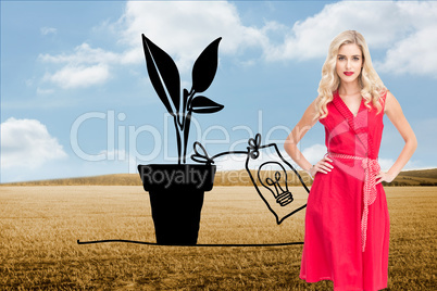 Composite image of elegant blonde standing hands on hips Composite image of elegant blonde standing hands on hips