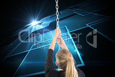 Composite image of businesswoman pulling a chain