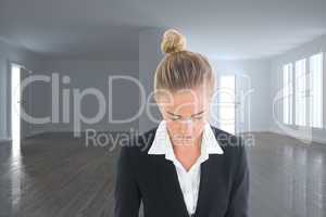 Composite image of businesswoman holding tablet