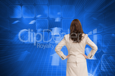 Composite image of businesswoman standing back to camera