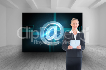 Composite image of businesswoman holding new tablet