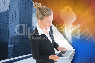 Composite image of businesswoman holding new tablet