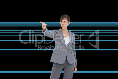 Composite image of young businesswoman pointing to something