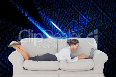 Composite image of business woman lying on couch