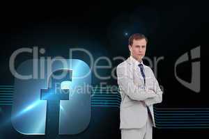 Composite image of serious businessman standing with his arms fo